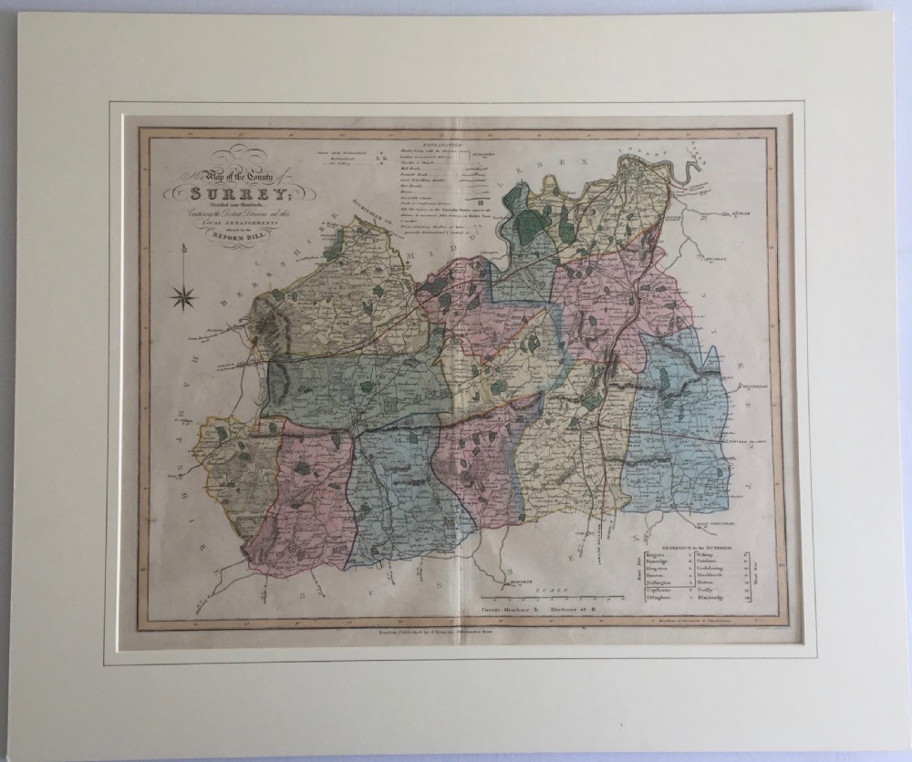 An 1833 hand-coloured engraved map of the county of Surrey by J. Duncan mounted in an off-white mat.