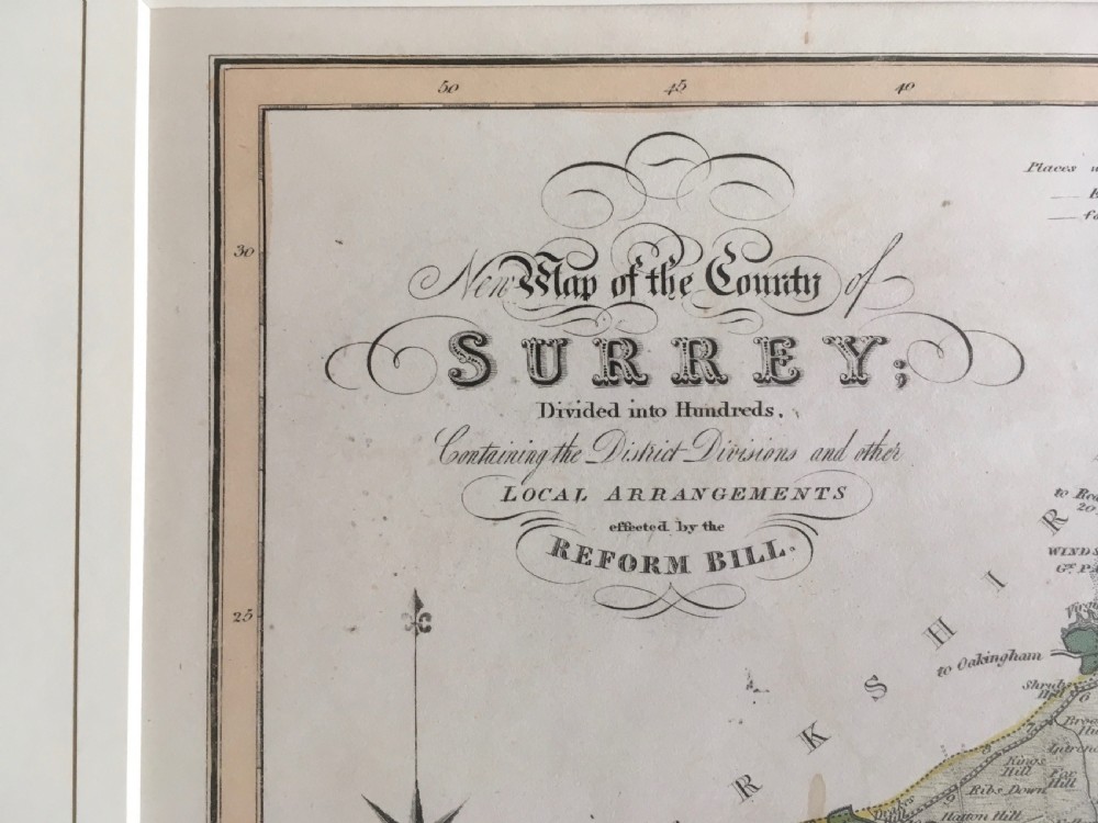 An 1833 hand-coloured engraved map of the county of Surrey by J. Duncan mounted in an off-white mat. View II