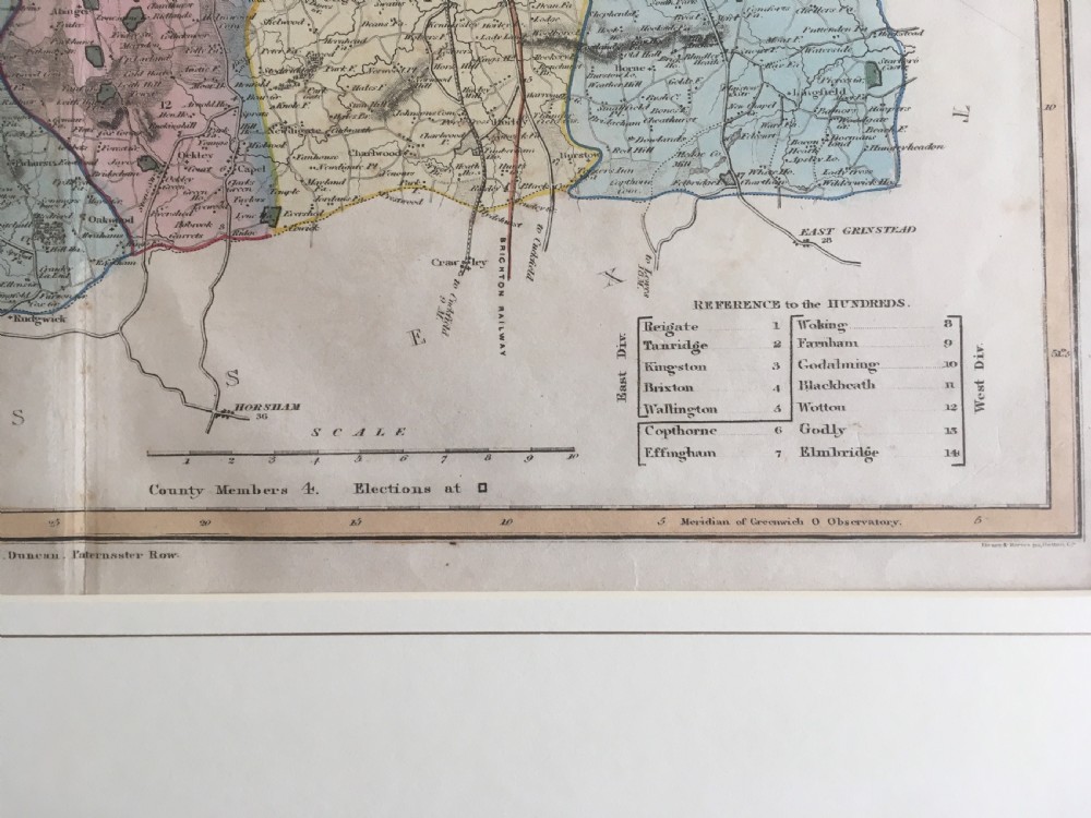 An 1833 hand-coloured engraved map of the county of Surrey by J. Duncan mounted in an off-white mat. View IV