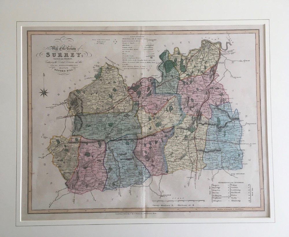 An 1833 hand-coloured engraved map of the county of Surrey by J. Duncan mounted in an off-white mat. View VI