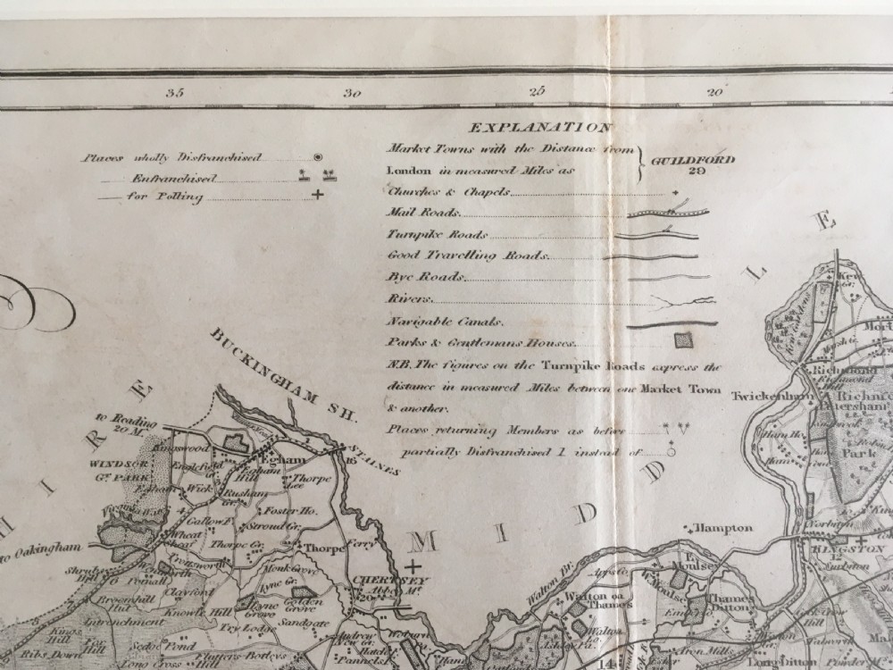 An 1833 hand-coloured engraved map of the county of Surrey by J. Duncan mounted in an off-white mat. View VIII