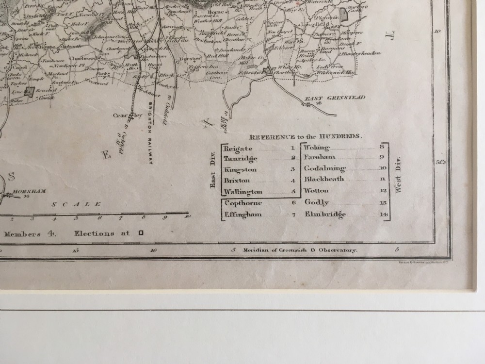 An 1833 hand-coloured engraved map of the county of Surrey by J. Duncan mounted in an off-white mat. View IX