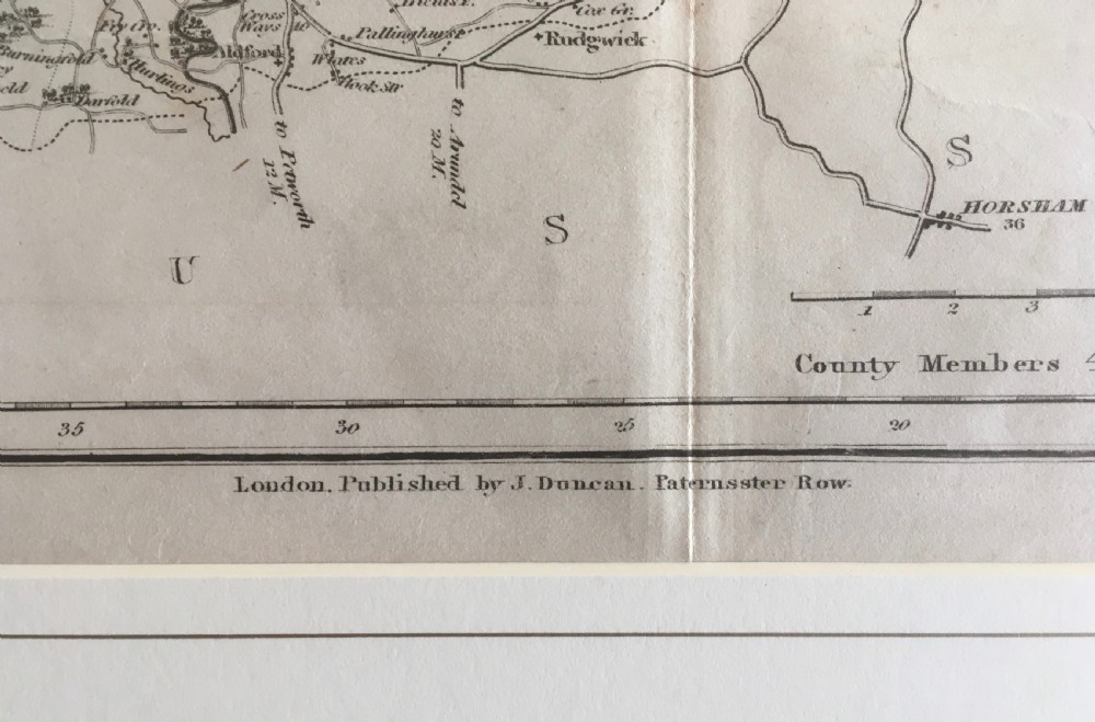 An 1833 hand-coloured engraved map of the county of Surrey by J. Duncan mounted in an off-white mat. View X