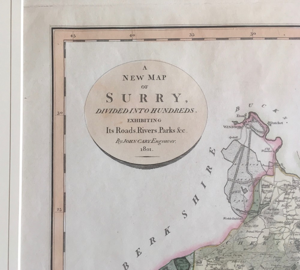 An antique hand-coloured engraved map of Surrey by John Cary, dated 1801, presented on a cream mount with an oval title cartouche. View II