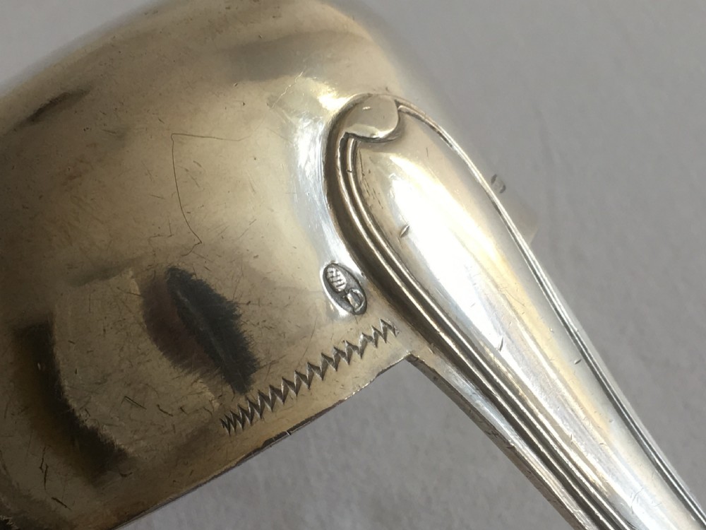 An antique silver soup or punch ladle featuring a deep gilt-washed bowl and a contoured handle. View III