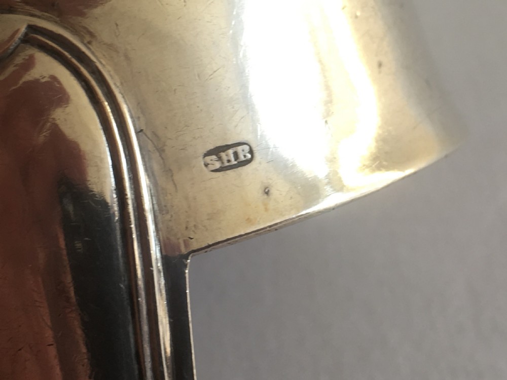 An antique silver soup or punch ladle featuring a deep gilt-washed bowl and a contoured handle. View IV
