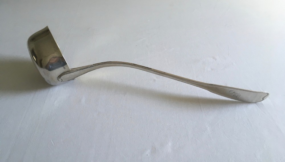 An antique silver soup or punch ladle featuring a deep gilt-washed bowl and a contoured handle. View VI