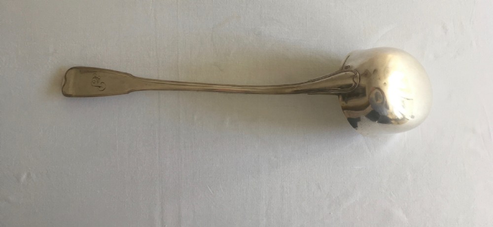 An antique silver soup or punch ladle featuring a deep gilt-washed bowl and a contoured handle. View VIII