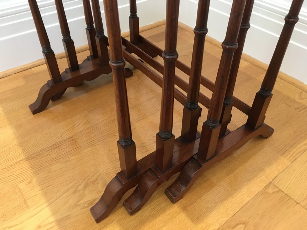 A set of three nested wooden side tables featuring rectangular tops with oval amboyna wood centres, inlaid satinwood borders, and slender turned legs. View IX