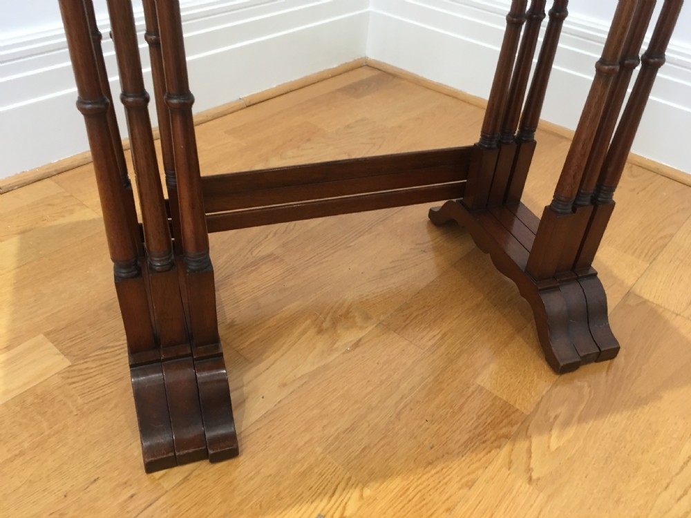 A set of three nested wooden side tables featuring rectangular tops with oval amboyna wood centres, inlaid satinwood borders, and slender turned legs. View XI