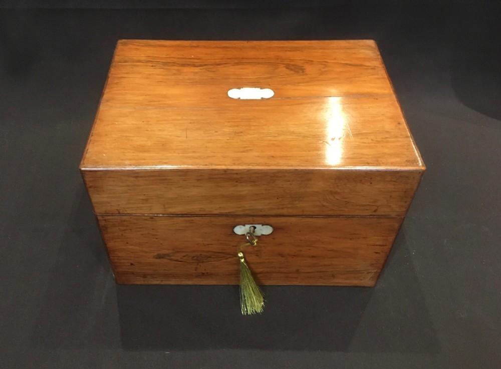 An open rosewood vanity box lined with vibrant blue velvet, containing cut glass jars, silver-plated lids, and manicure tools. View II