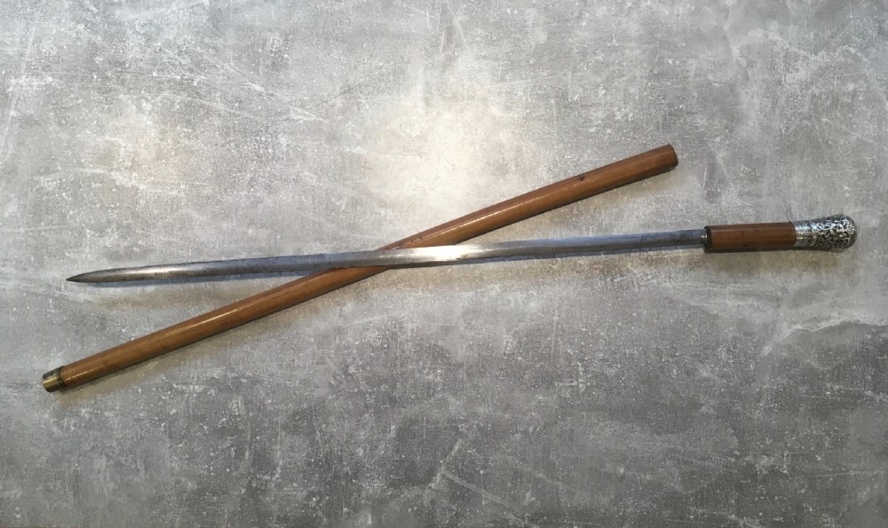 Late 19th Century Malacca Sword Stick with Silver Repousse Handle