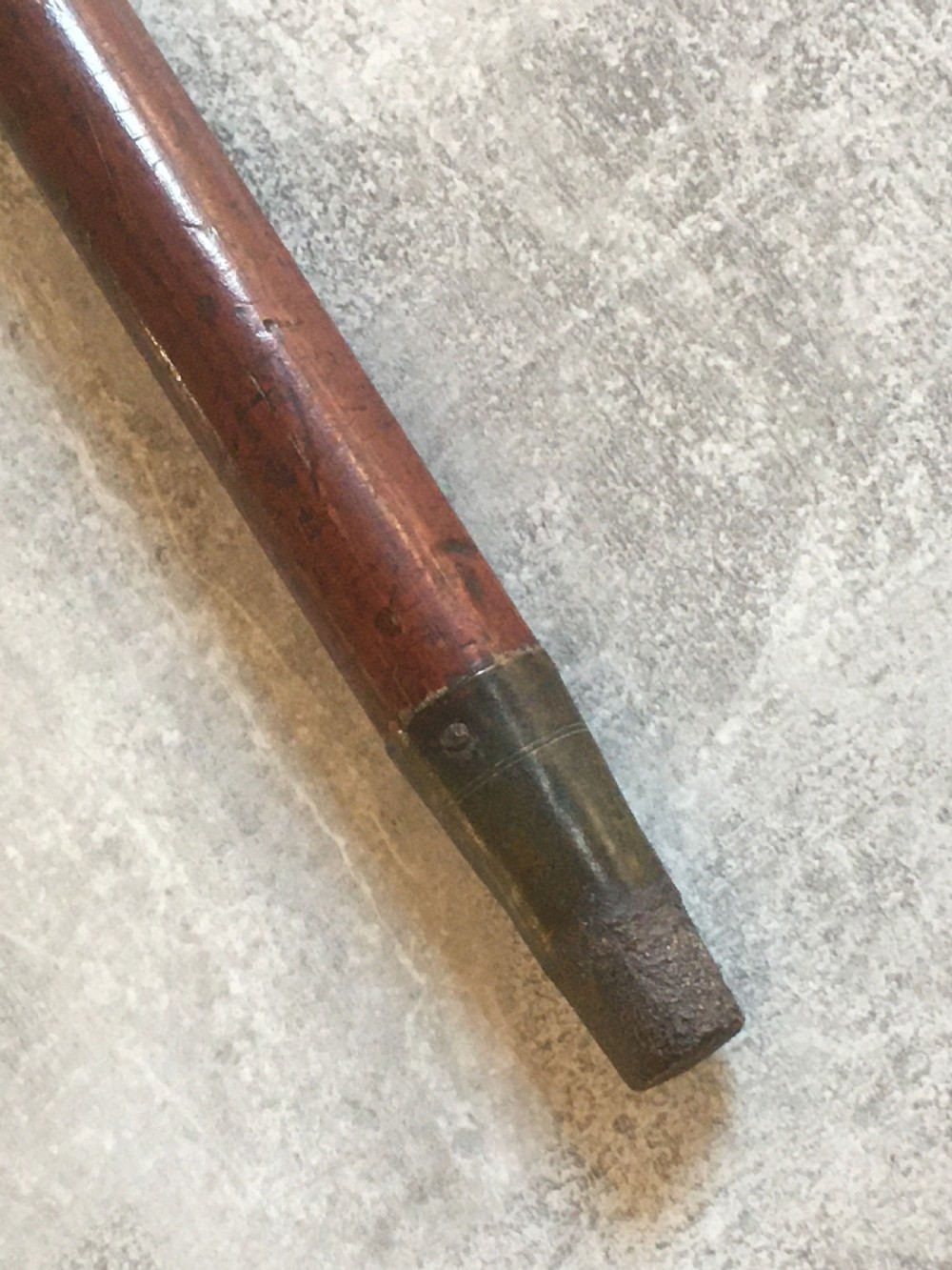An antique Malacca wood walking stick featuring a carved stag antler handle and silver collar, drawn to reveal a long steel concealed blade. View IX