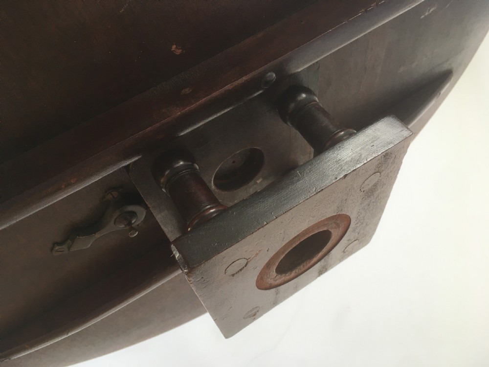 A Georgian mahogany tilt top table featuring a circular top, turned central pedestal, and tripod cabriole legs. View VII