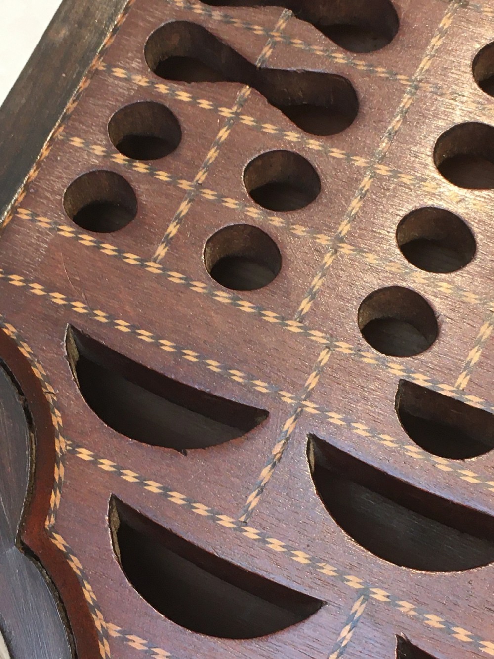 A George III mahogany slanted-top knife box shown open, featuring slotted interior fittings, string inlay, and a star marquetry motif on the inside lid. View IV