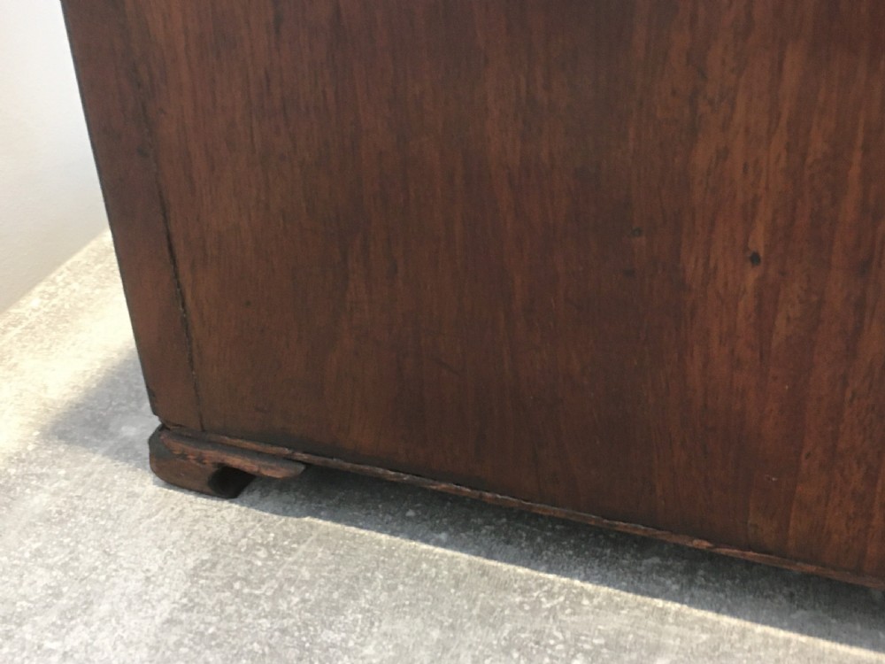 A George III mahogany slanted-top knife box shown open, featuring slotted interior fittings, string inlay, and a star marquetry motif on the inside lid. View XI