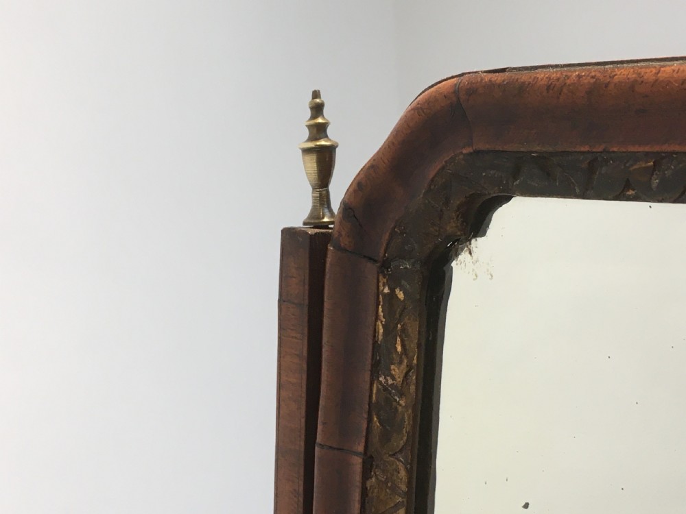 An 18th-century walnut toilet mirror featuring an adjustable rectangular glass frame set above a stepped base with small drawers and brass drop handles. View XI