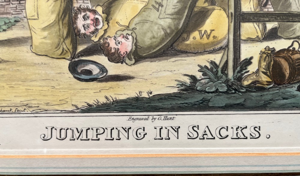 A framed Georgian hand-coloured satirical print titled Jumping in Sacks depicting figures participating in a sack race within a gilded wood frame and lined cream mount. View IV