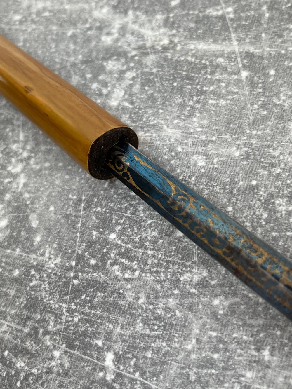 A late Victorian Malacca cane sword stick featuring a silver repousse embossed knop handle and a concealed steel blade alongside its wooden sheath. View VII