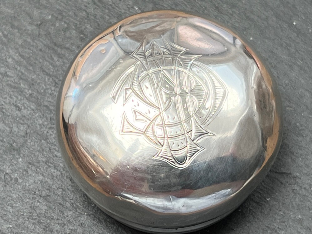 Pair of faceted clear cut glass vanity jars fitted with silver tops featuring engraved and chased detailing. View VII