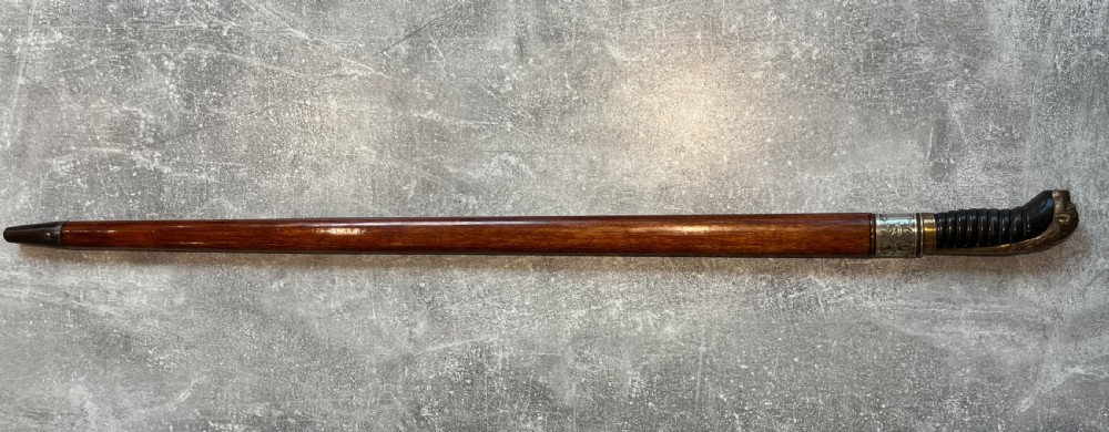 Oval Malacca Sword Cane with Brass Lions Head Handle