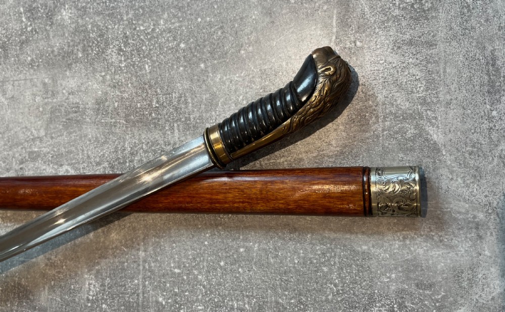 Oval Malacca Sword Cane with Brass Lions Head Handle View III