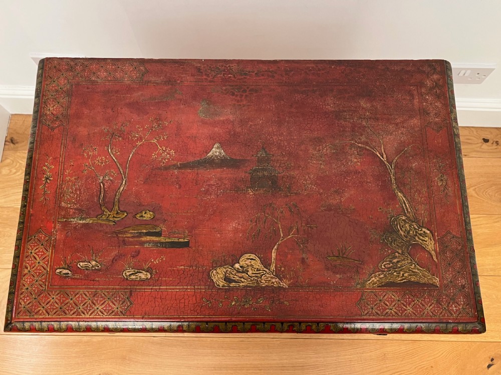 A red lacquered side table decorated with hand-painted gilt chinoiserie landscapes, featuring two drawers with brass handles and long cabriole legs. View XIV