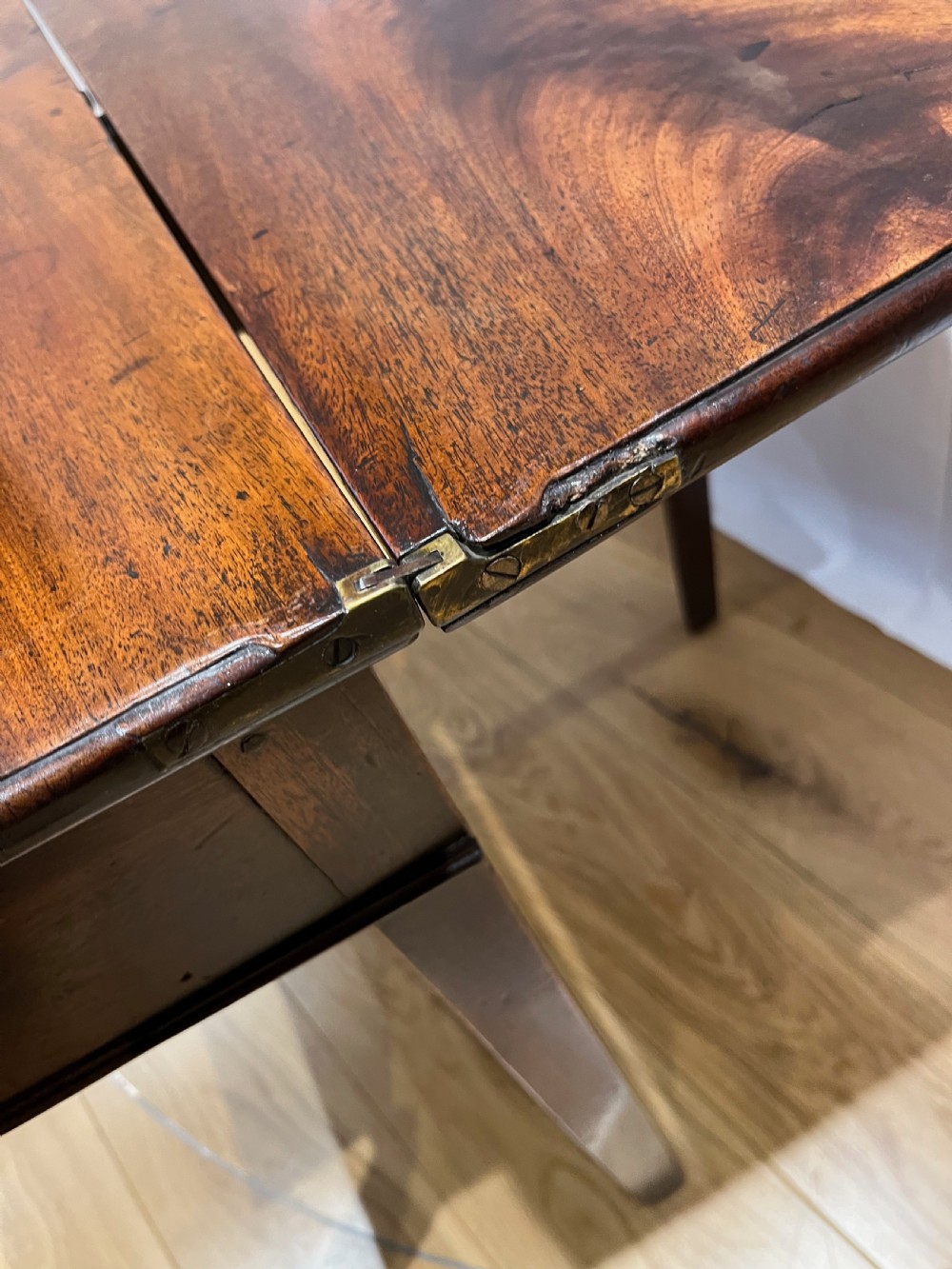 A Regency mahogany fold-over side table featuring tapered square legs, a single drawer with twin circular brass handles, and a hinged timber top. View IX