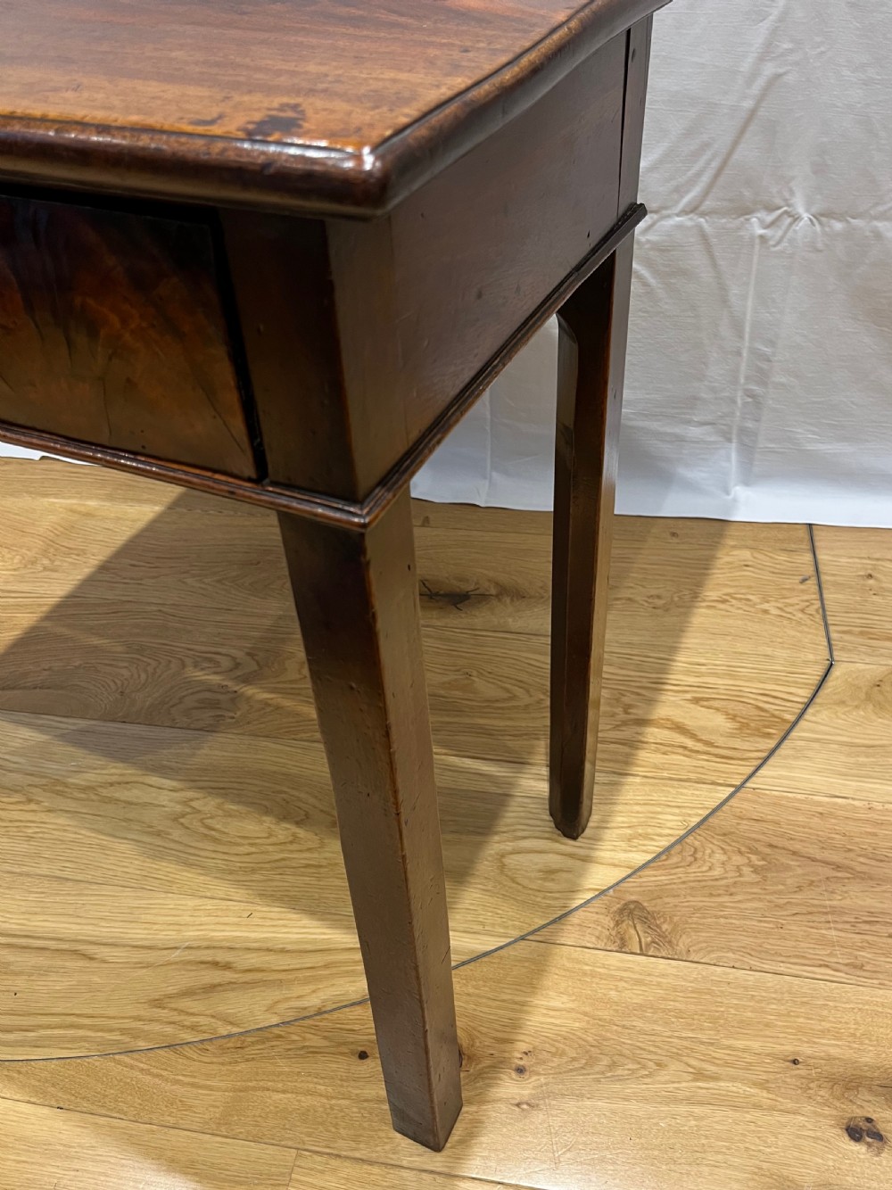 A Regency mahogany fold-over side table featuring tapered square legs, a single drawer with twin circular brass handles, and a hinged timber top. View X