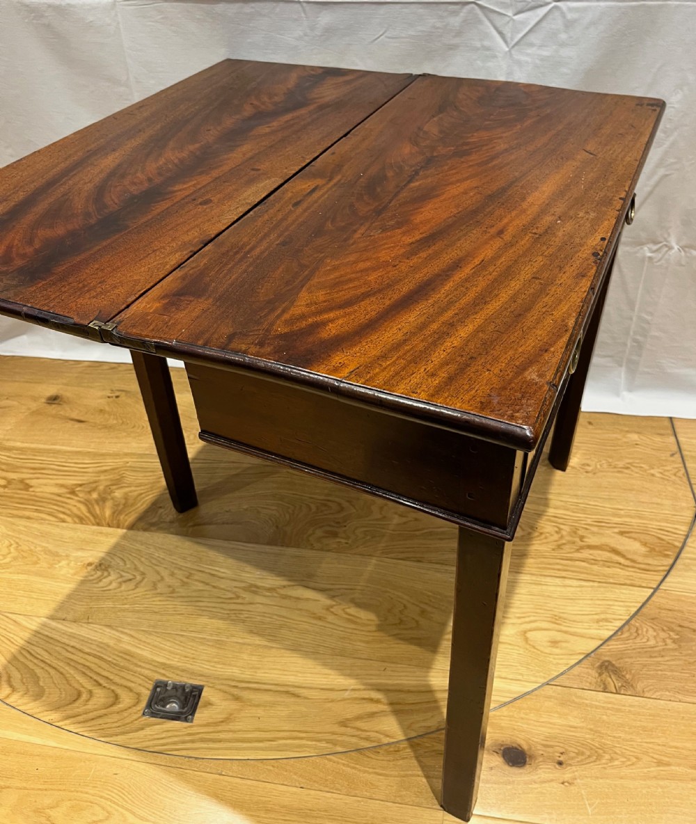A Regency mahogany fold-over side table featuring tapered square legs, a single drawer with twin circular brass handles, and a hinged timber top. View XI