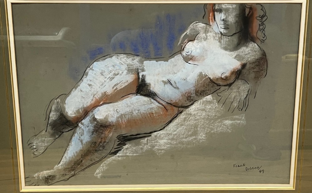 A mid-twentieth-century figure drawing by Frank Dobson depicting a reclining female nude executed in charcoal, white chalk, terracotta, and blue pastel on grey paper. View III