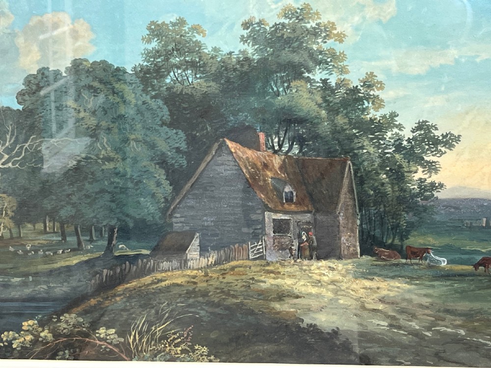 A framed 19th-century watercolour painting featuring a rustic cottage nestled among lush trees with livestock in a rolling landscape, presented in a gilt frame. View V