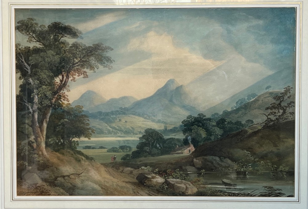 A framed 19th-century watercolour painting featuring a rustic cottage nestled among lush trees with livestock in a rolling landscape, presented in a gilt frame. View VIII