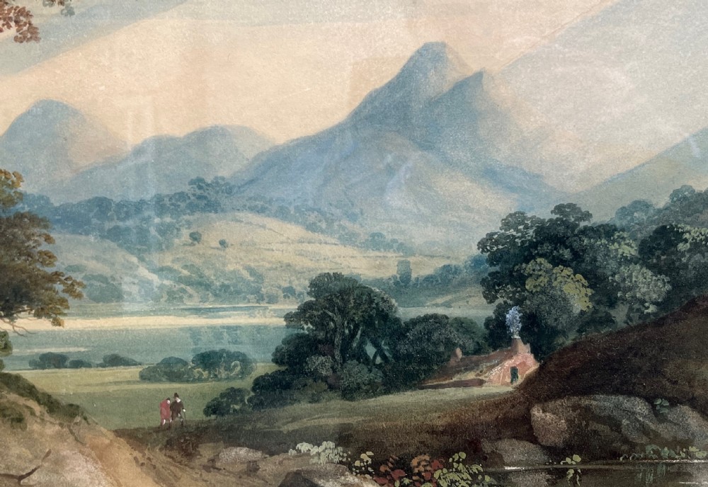 A framed 19th-century watercolour painting featuring a rustic cottage nestled among lush trees with livestock in a rolling landscape, presented in a gilt frame. View IX