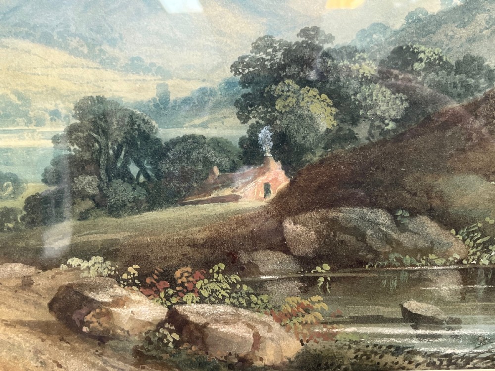 A framed 19th-century watercolour painting featuring a rustic cottage nestled among lush trees with livestock in a rolling landscape, presented in a gilt frame. View XIII
