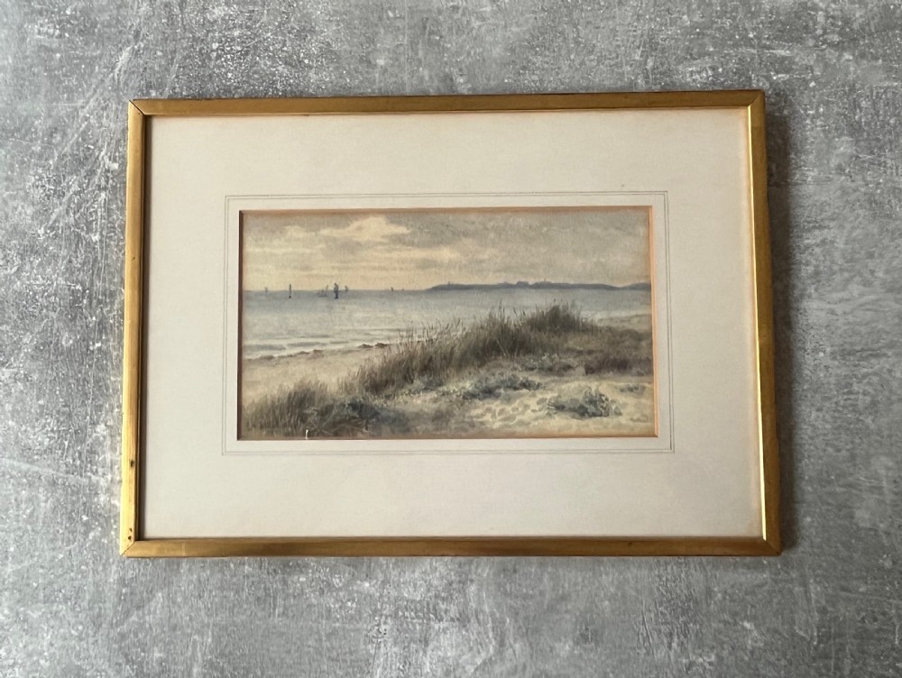An antique framed watercolour painting depicting sand dunes in the foreground and distant sailboats on a calm sea under an overcast sky. View III