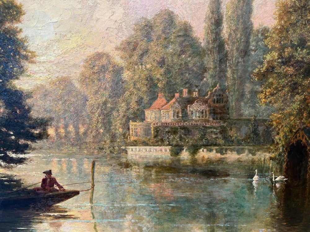 An antique framed oil painting depicting a tranquil river Thames scene with a figure in a boat, swans near a boathouse, and a riverbank estate beneath a glowing sky. View III