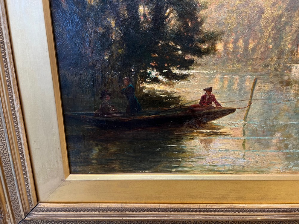 An antique framed oil painting depicting a tranquil river Thames scene with a figure in a boat, swans near a boathouse, and a riverbank estate beneath a glowing sky. View IV