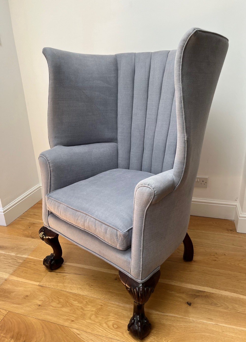A high-backed Victorian barrel back armchair upholstered in light grey fabric, featuring channel-tufted back detailing and dark carved cabriole legs with ball and claw feet. View VIII