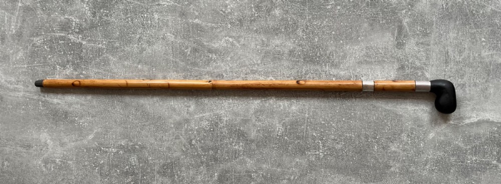 An antique bamboo walking stick shown disassembled to reveal a long steel blade and a dark curved pistol-grip handle with metal ferrules. View XIII