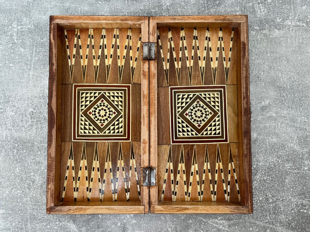 A hinged wooden folding games board featuring intricate geometric micro-mosaic marquetry and mother-of-pearl star motifs. View II