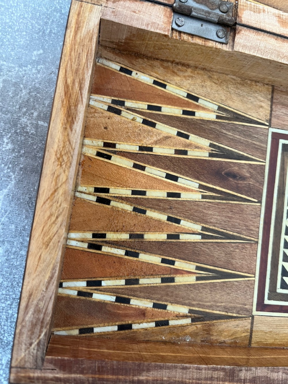 A hinged wooden folding games board featuring intricate geometric micro-mosaic marquetry and mother-of-pearl star motifs. View X