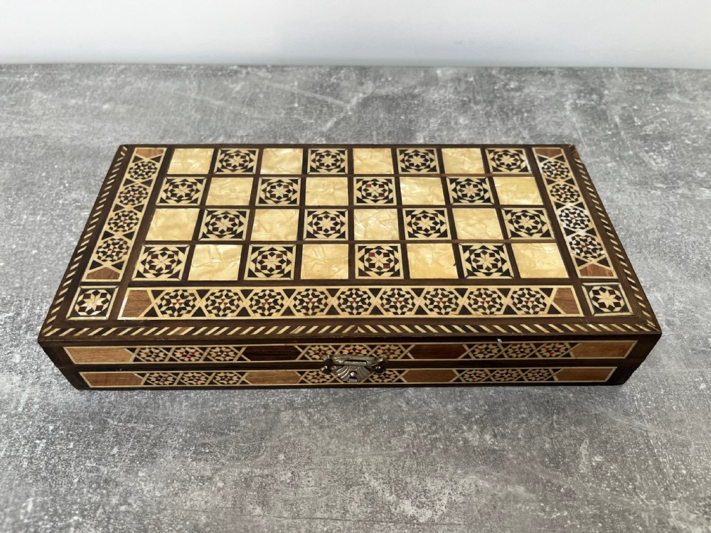 A hinged wooden folding games board featuring intricate geometric micro-mosaic marquetry and mother-of-pearl star motifs. View XI