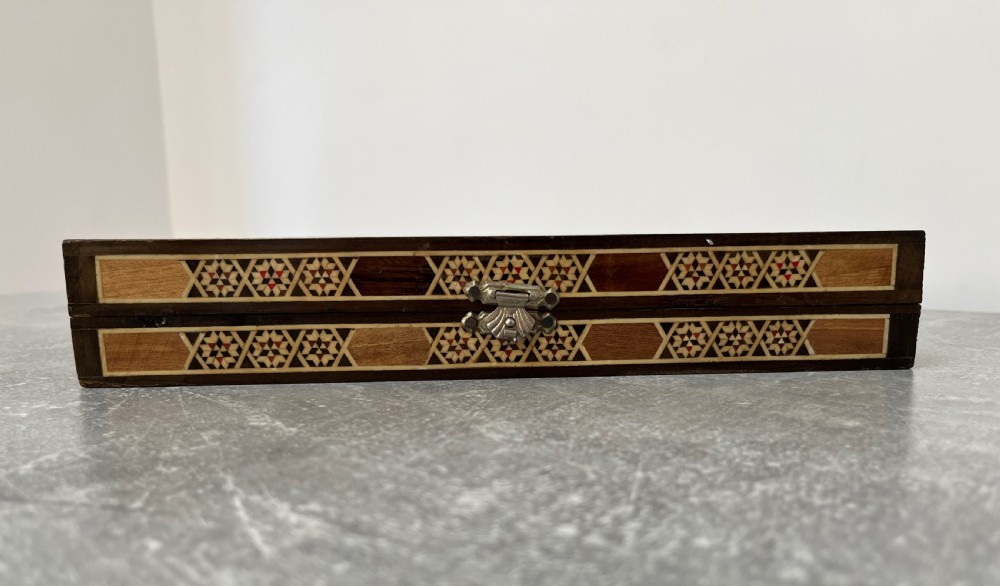 A hinged wooden folding games board featuring intricate geometric micro-mosaic marquetry and mother-of-pearl star motifs. View XII
