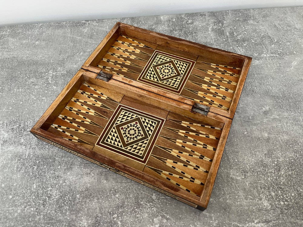 A hinged wooden folding games board featuring intricate geometric micro-mosaic marquetry and mother-of-pearl star motifs. View XIII