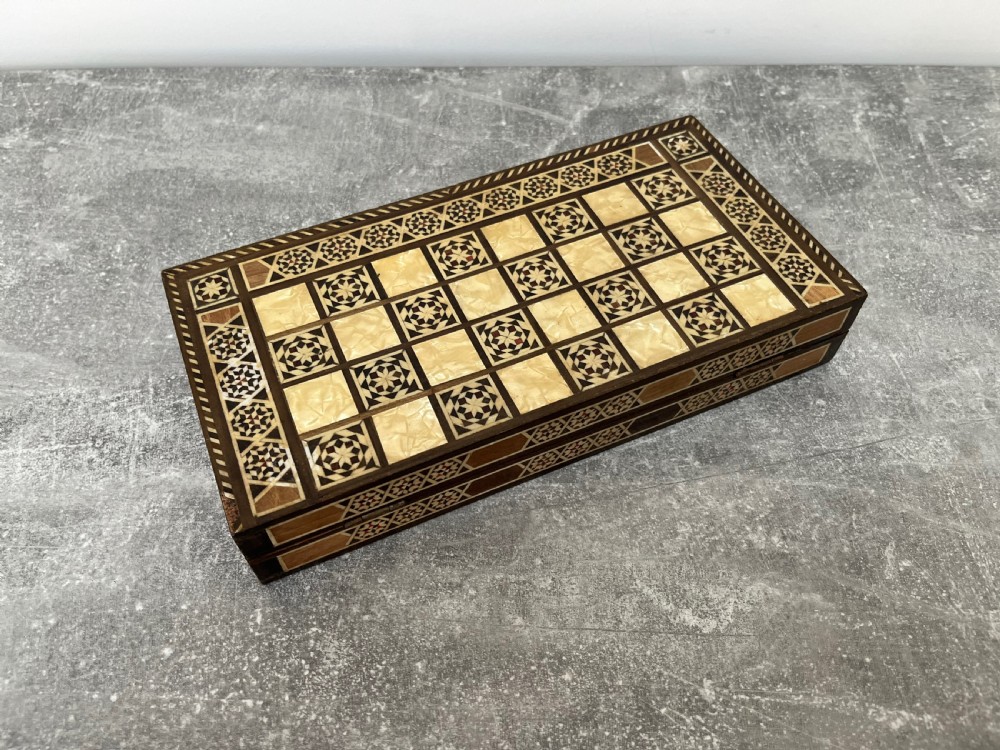 A hinged wooden folding games board featuring intricate geometric micro-mosaic marquetry and mother-of-pearl star motifs. View XIV