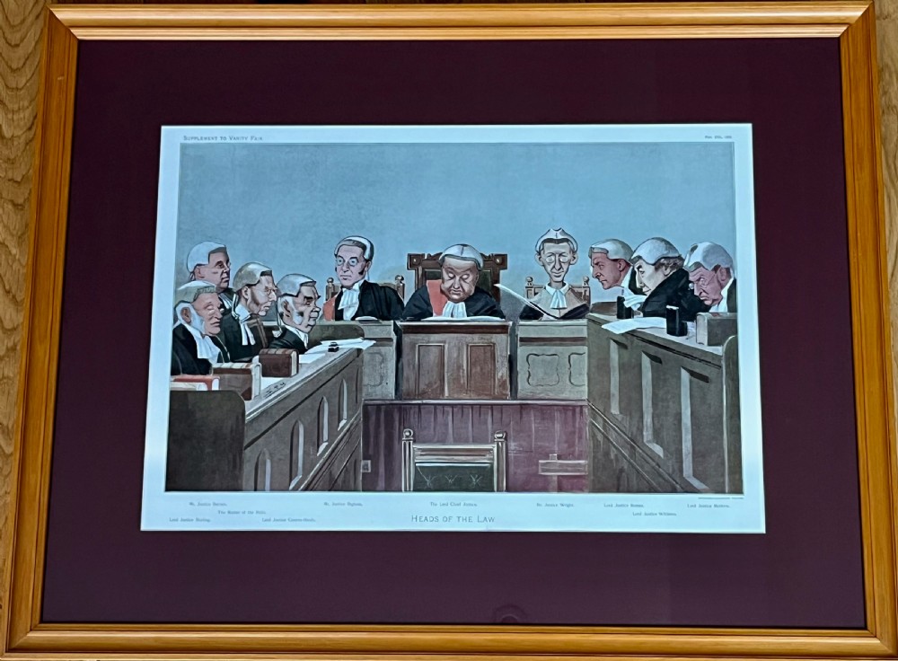 A framed late Victorian lithographic print entitled Bench and Bar featuring a crowd of barristers and judges in traditional wigs and gowns framed in light wood with a burgundy mount. View V