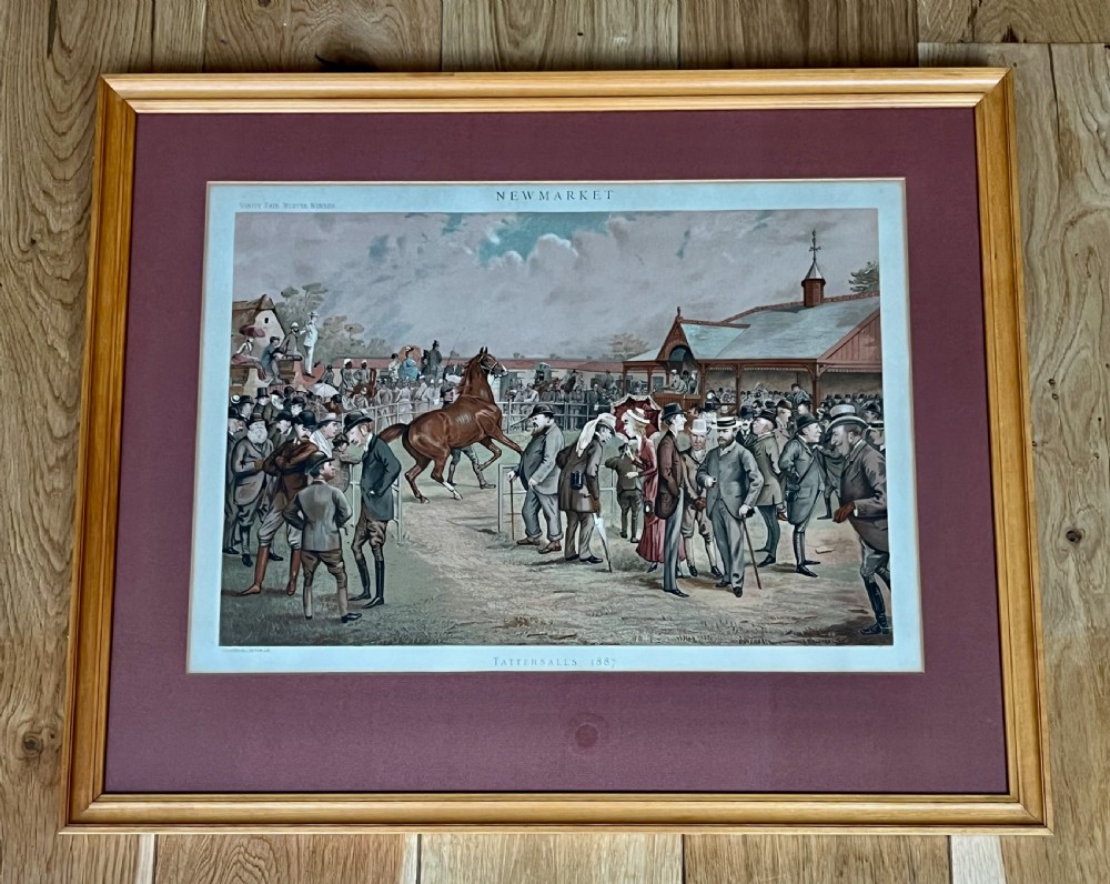 A Victorian framed Vanity Fair chromolithograph print titled Newmarket 1885 depicting an equestrian caricature scene inside a dark green mount and light wood frame. View VII