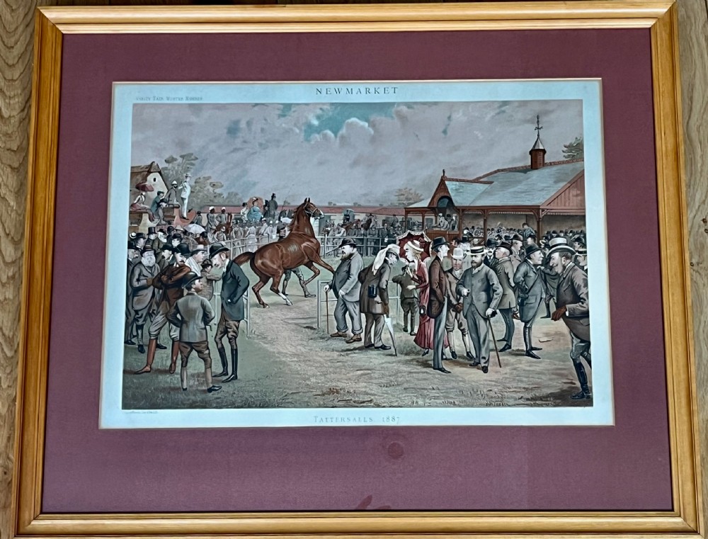 A Victorian framed Vanity Fair chromolithograph print titled Newmarket 1885 depicting an equestrian caricature scene inside a dark green mount and light wood frame. View IX