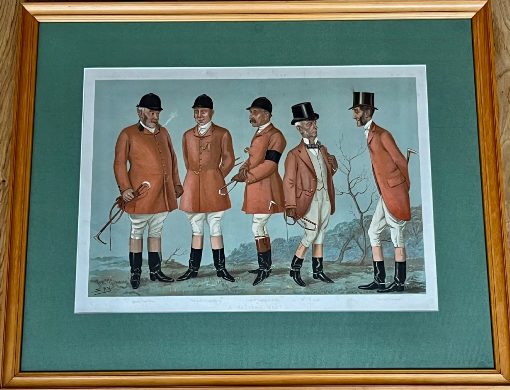 A framed Vanity Fair colour lithograph depicting five gentlemen in traditional red hunting attire set against a blue backdrop within a green card mount and simple wooden frame. View II